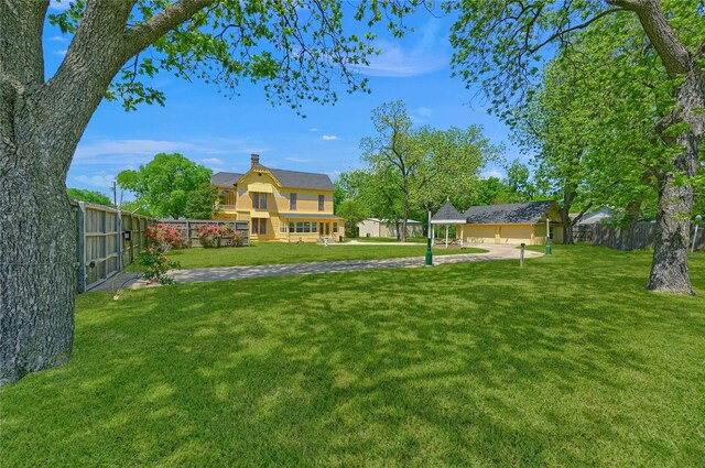 view of yard featuring a gazebo and fence