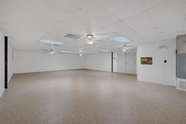 unfurnished room featuring a paneled ceiling and a ceiling fan