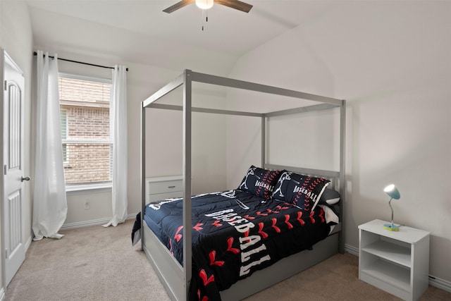 bedroom with lofted ceiling, a ceiling fan, baseboards, and carpet