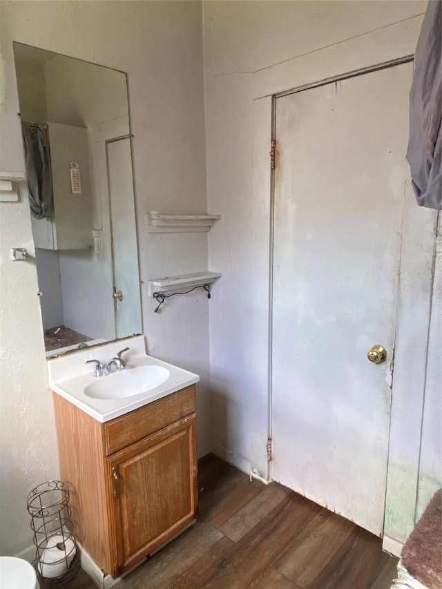 1530 Southerland Ave, Dallas, TX 75203 - half bath with wood finished floors, toilet, and vanity
