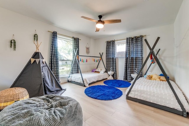 4043 Flintridge Dr, Dallas, TX 75244 - bedroom with wood finished floors and a ceiling fan