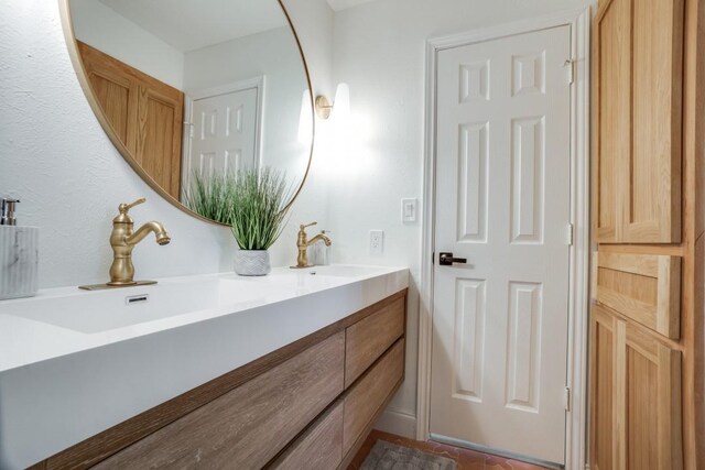 4043 Flintridge Dr, Dallas, TX 75244 - full bathroom featuring double vanity and a sink