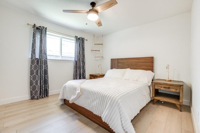 4043 Flintridge Dr, Dallas, TX 75244 - bedroom with baseboards, a ceiling fan, and wood finished floors
