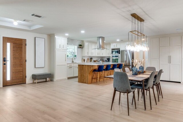 4043 Flintridge Dr, Dallas, TX 75244 - dining space featuring recessed lighting, a chandelier, light wood-style flooring, and visible vents
