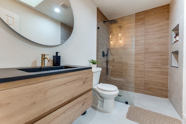 4043 Flintridge Dr, Dallas, TX 75244 - full bath featuring tile patterned floors, toilet, visible vents, vanity, and a walk in shower