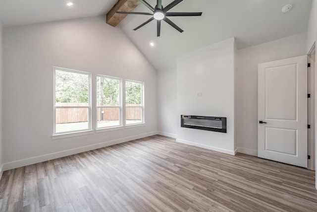 unfurnished living room featuring high vaulted ceiling, light wood-style floors, ceiling fan, baseboards, and beam ceiling