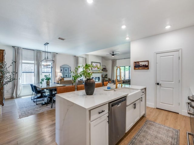 kitchen featuring light countertops, a sink, tasteful backsplash, appliances with stainless steel finishes, and custom exhaust hood