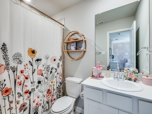 bedroom featuring wallpapered walls, baseboards, an accent wall, and a notable chandelier