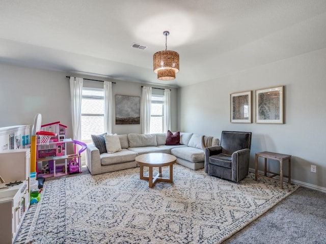 bedroom with wainscoting, ceiling fan, and multiple windows