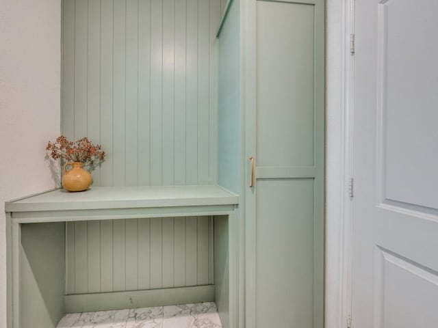 clothes washing area with visible vents, baseboards, marble finish floor, independent washer and dryer, and cabinet space