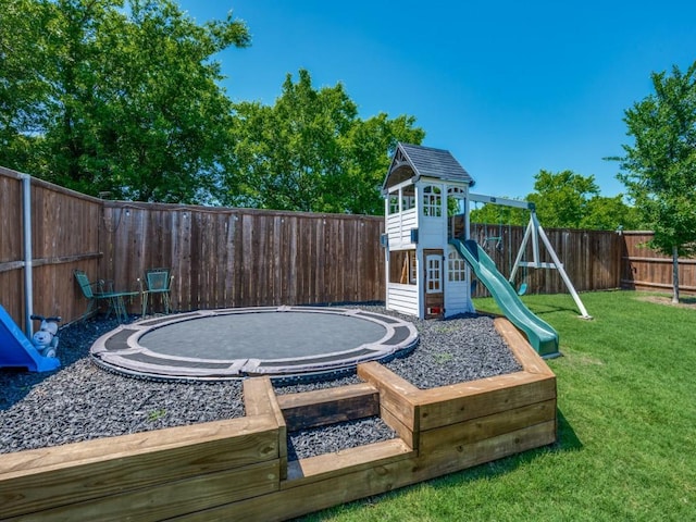 view of patio / terrace with a fenced backyard, a playground, and an outdoor fire pit