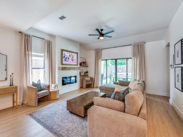 dining room with visible vents, light wood finished floors, baseboards, and ceiling fan with notable chandelier