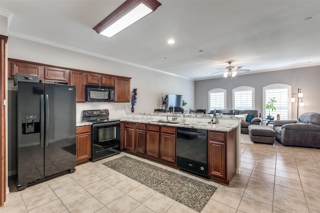 575 S Virginia Hills Dr Unit 1502, Mckinney, TX 75072 - kitchen featuring black appliances, a peninsula, a sink, light tile patterned floors, and crown molding