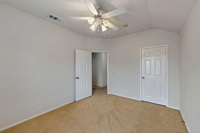 8413 Vicksburg Ln, Fort Worth, TX 76123 - unfurnished bedroom with carpet floors, baseboards, a textured ceiling, vaulted ceiling, and ceiling fan