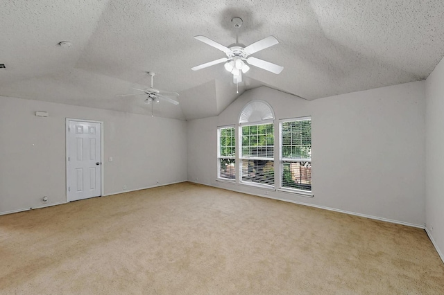 8413 Vicksburg Ln, Fort Worth, TX 76123 - carpeted spare room featuring ceiling fan, vaulted ceiling, a textured ceiling, and baseboards