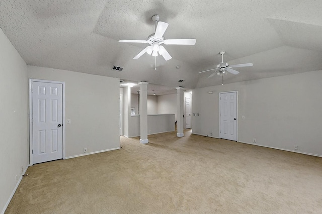 8413 Vicksburg Ln, Fort Worth, TX 76123 - unfurnished living room with ornate columns, light colored carpet, a ceiling fan, vaulted ceiling, and baseboards