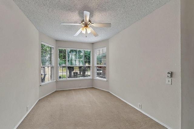 8413 Vicksburg Ln, Fort Worth, TX 76123 - carpeted spare room featuring a textured ceiling, a ceiling fan, and baseboards