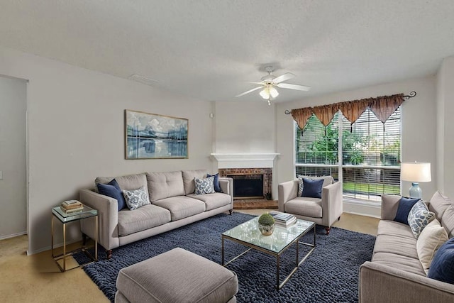 8413 Vicksburg Ln, Fort Worth, TX 76123 - living room featuring a ceiling fan, light colored carpet, and a fireplace with raised hearth