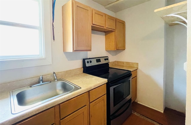 104 W Adkins St, Seagoville, TX 75159 - kitchen featuring electric range, a sink, and light countertops