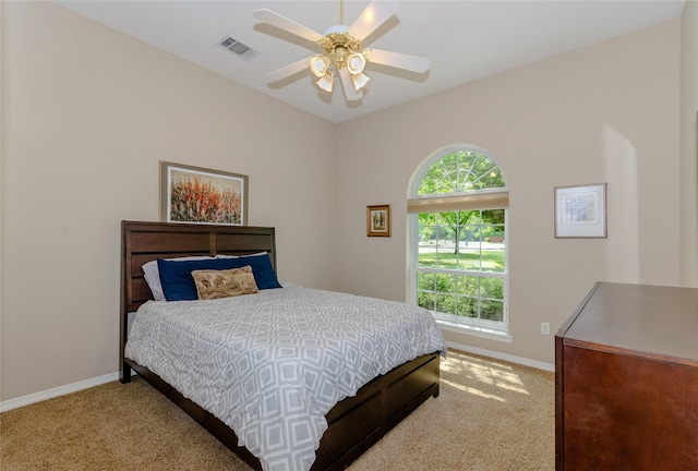 bedroom with baseboards, visible vents, a ceiling fan, and carpet flooring