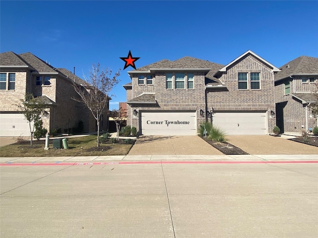 view of front of home with brick siding, a garage, and concrete driveway