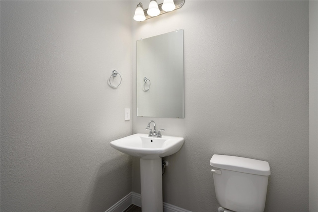 bathroom with a sink and toilet