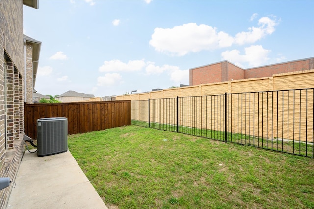 view of yard featuring cooling unit and a fenced backyard