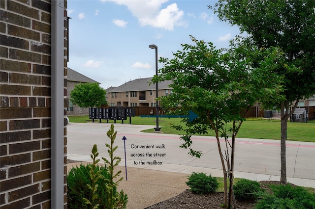 exterior space featuring curbs and street lights