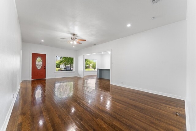 unfurnished living room featuring baseboards, a ceiling fan, wood finished floors, and recessed lighting