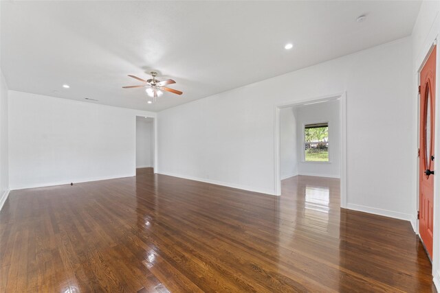spare room featuring baseboards, recessed lighting, ceiling fan, and dark wood-style flooring