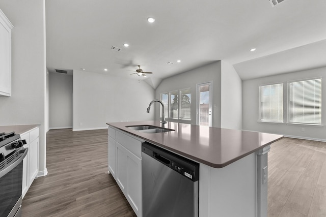 kitchen featuring a ceiling fan, a sink, open floor plan, appliances with stainless steel finishes, and visible vents