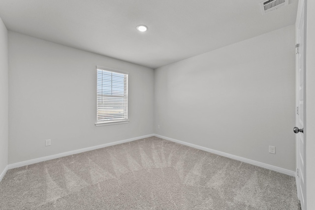 empty room featuring visible vents, baseboards, carpet flooring, and recessed lighting