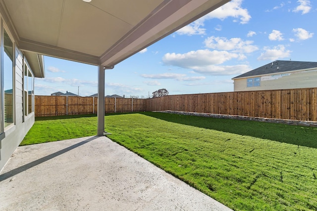 view of yard with a fenced backyard and a patio
