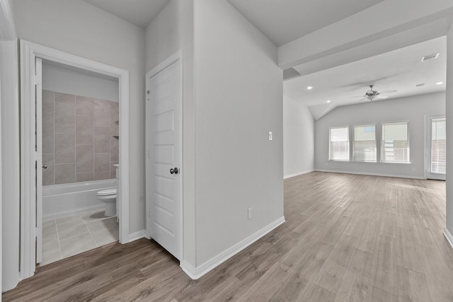 interior space with a ceiling fan, wood finished floors, visible vents, and recessed lighting