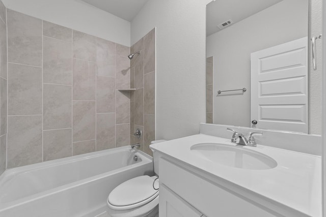 bathroom featuring shower / bathing tub combination, visible vents, vanity, and toilet