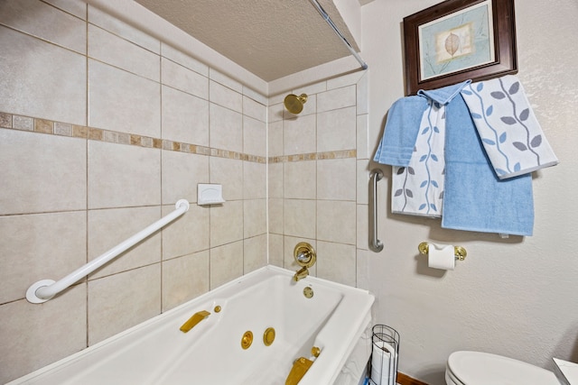 full bath with toilet, a textured ceiling, and a combined bath / shower with jetted tub