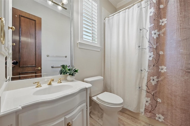 full bath with toilet, wood finished floors, a shower with shower curtain, crown molding, and vanity