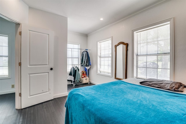 14357 Fm 1392, Terrell, TX 75160 - bedroom with baseboards, ornamental molding, and dark wood-style flooring