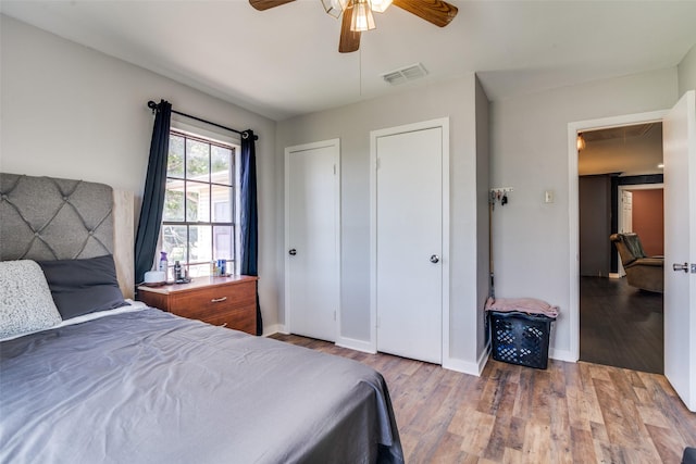 14357 Fm 1392, Terrell, TX 75160 - bedroom featuring visible vents, baseboards, wood finished floors, and ceiling fan