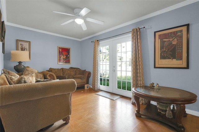 living area featuring crown molding, ceiling fan, and french doors