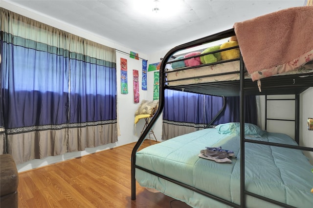 bedroom with wood finished floors