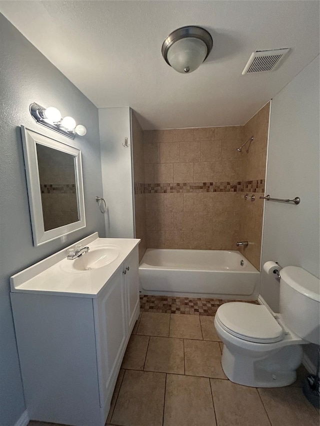 bathroom featuring tile patterned floors, vanity, shower / bath combination, toilet, and visible vents