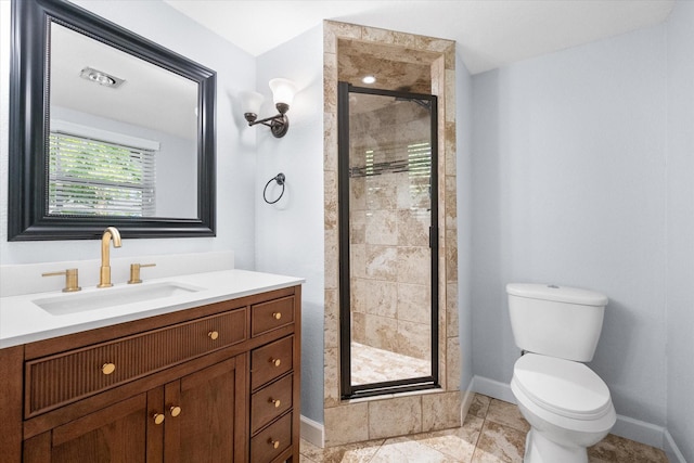 full bathroom featuring baseboards, toilet, vanity, and a stall shower
