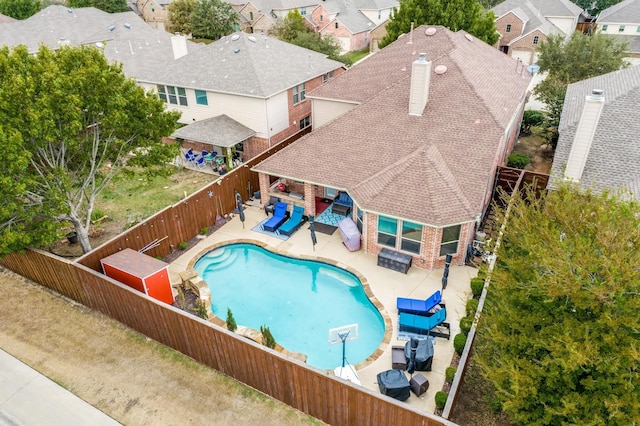 10625 Sexton Dr, Mckinney, TX 75072 - view of swimming pool featuring a fenced backyard, an outdoor hangout area, a patio, and a residential view