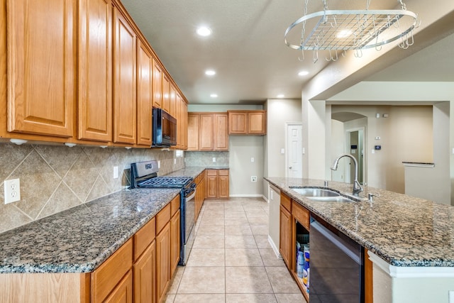 10625 Sexton Dr, Mckinney, TX 75072 - kitchen featuring stainless steel gas stove, black microwave, dishwashing machine, brown cabinetry, and backsplash