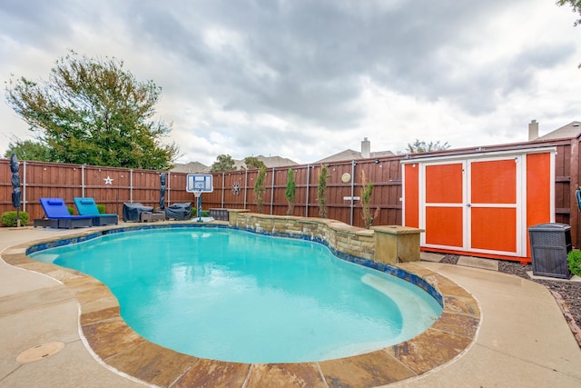 10625 Sexton Dr, Mckinney, TX 75072 - view of swimming pool featuring a shed and a fenced backyard