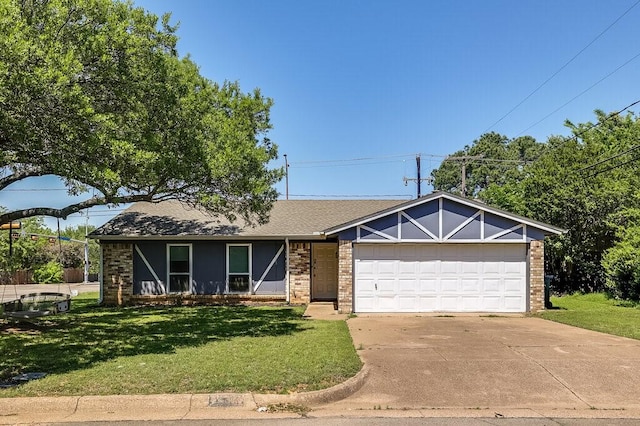 ranch-style home with a garage, concrete driveway, a shingled roof, a front yard, and brick siding