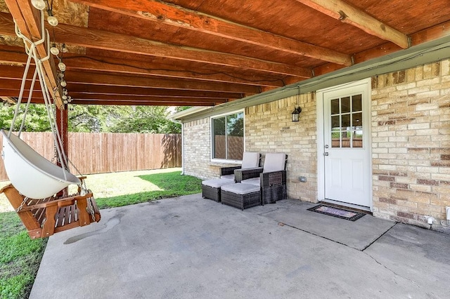 view of patio featuring fence
