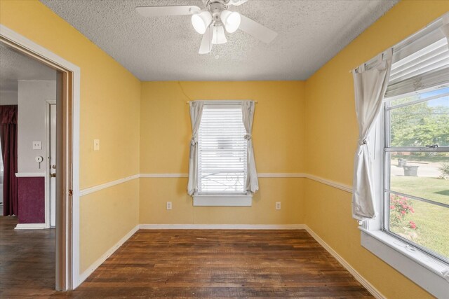 unfurnished room featuring ceiling fan, baseboards, wood finished floors, and a textured ceiling