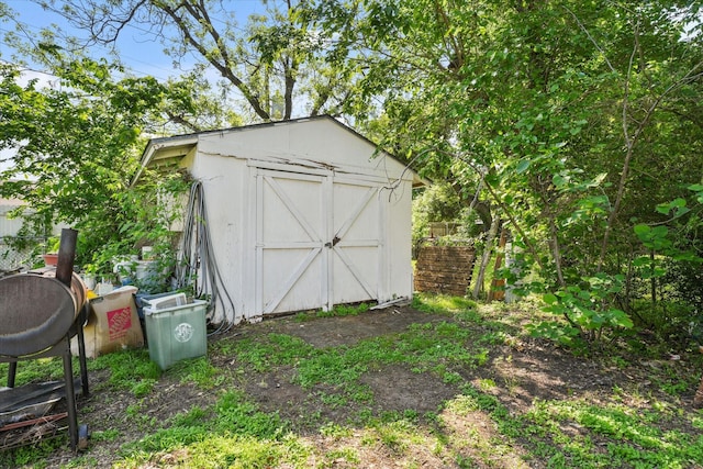 view of shed with fence